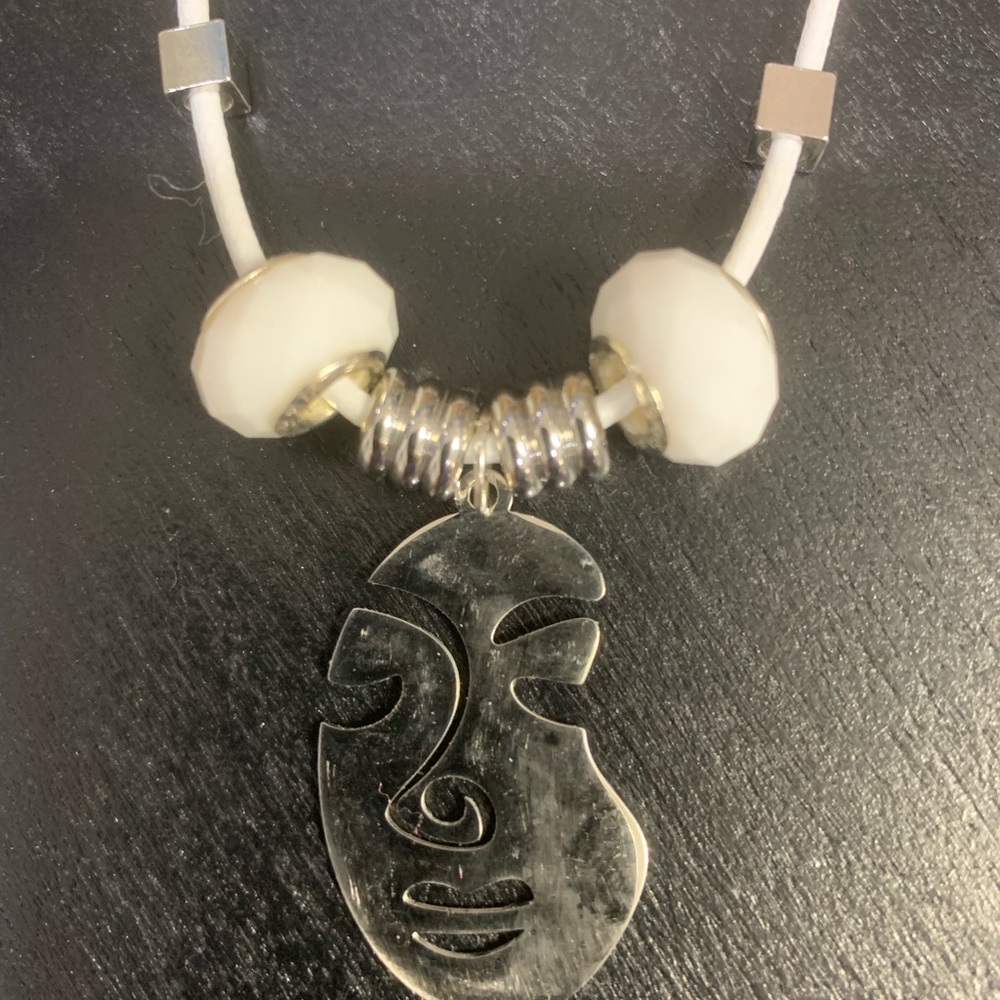 Leather cord with stainless steel face pendant